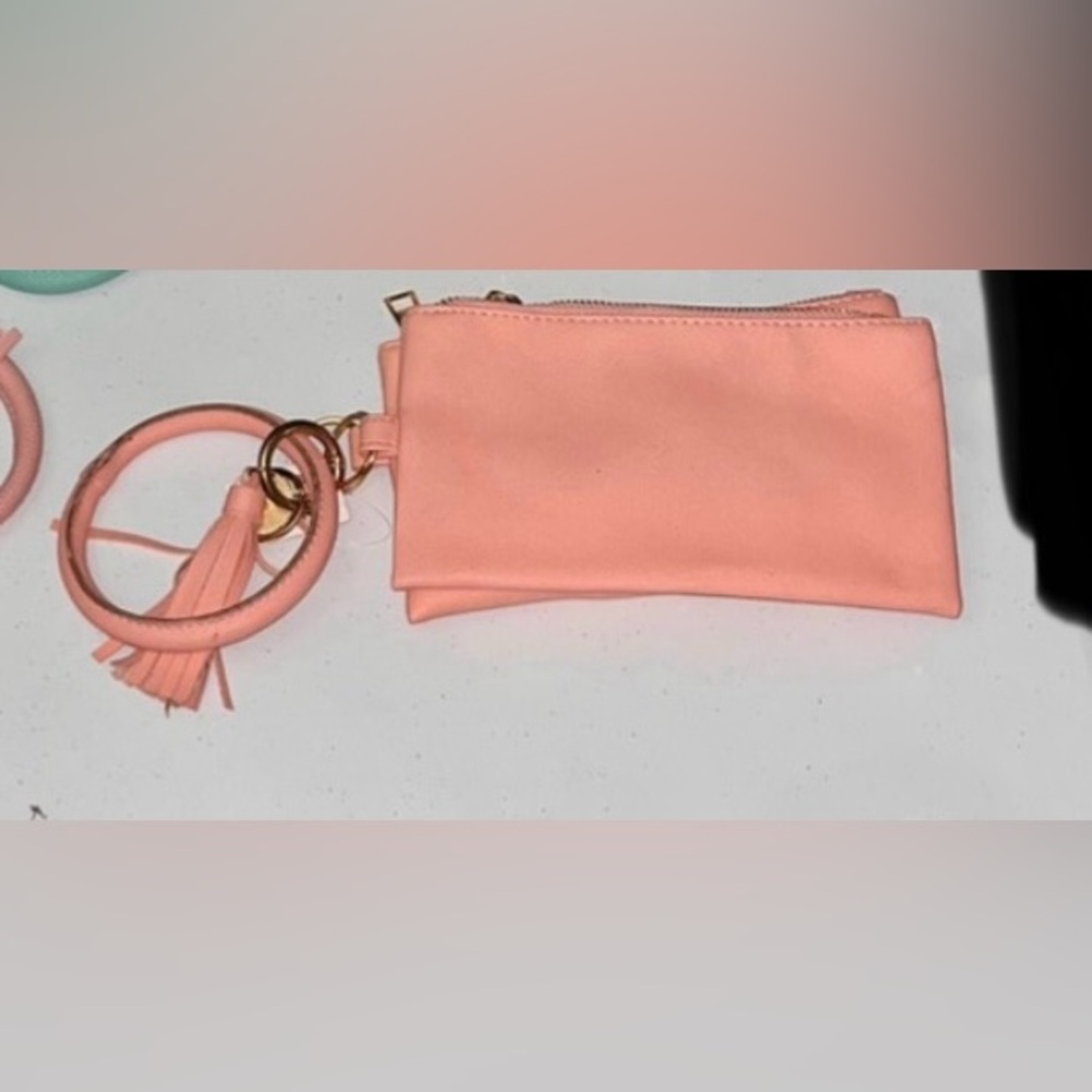 💙 NWT Peach Pink Wristlet with Tassel & Charm